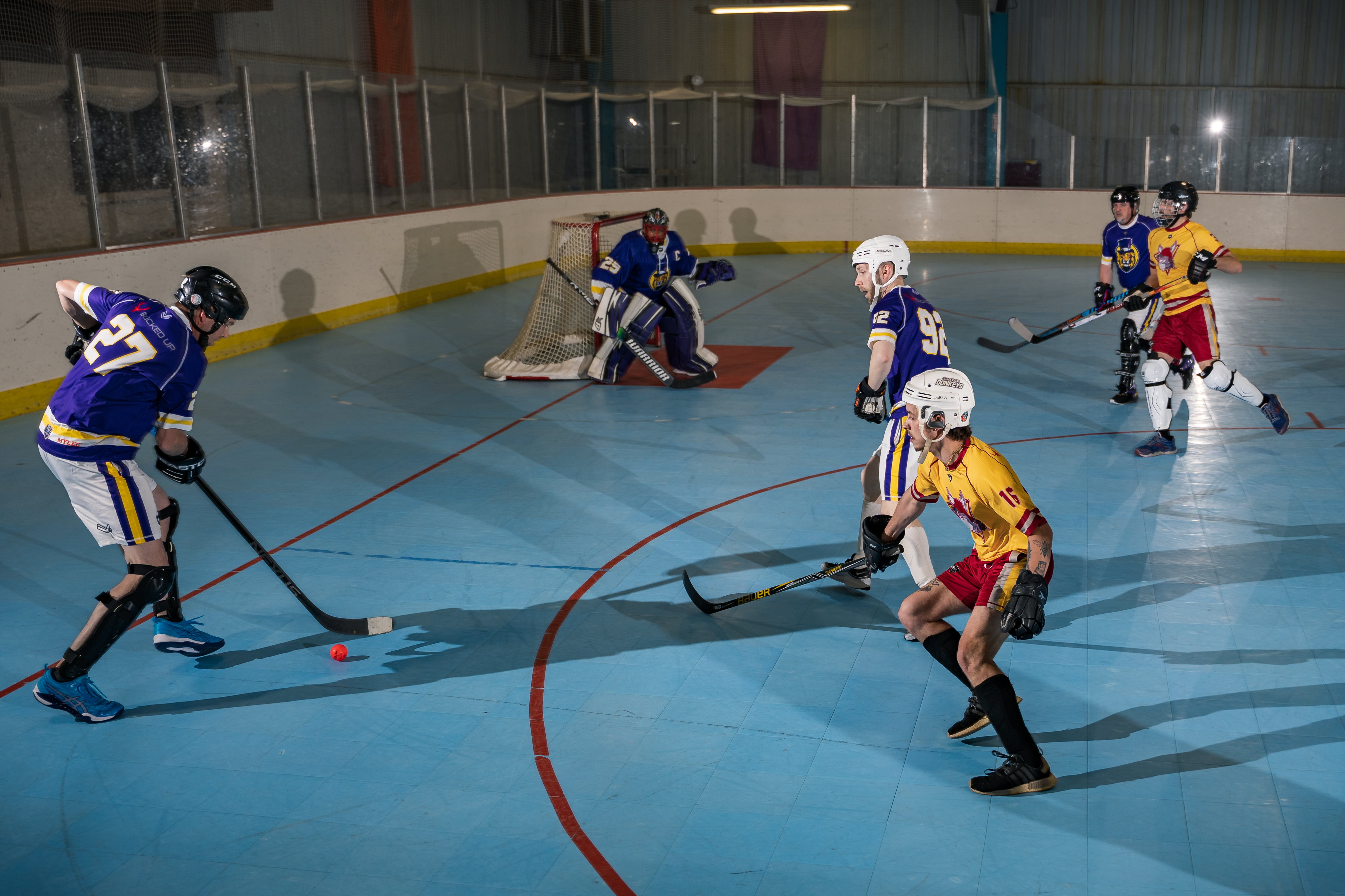 Ball hockey action at an IBHA rink