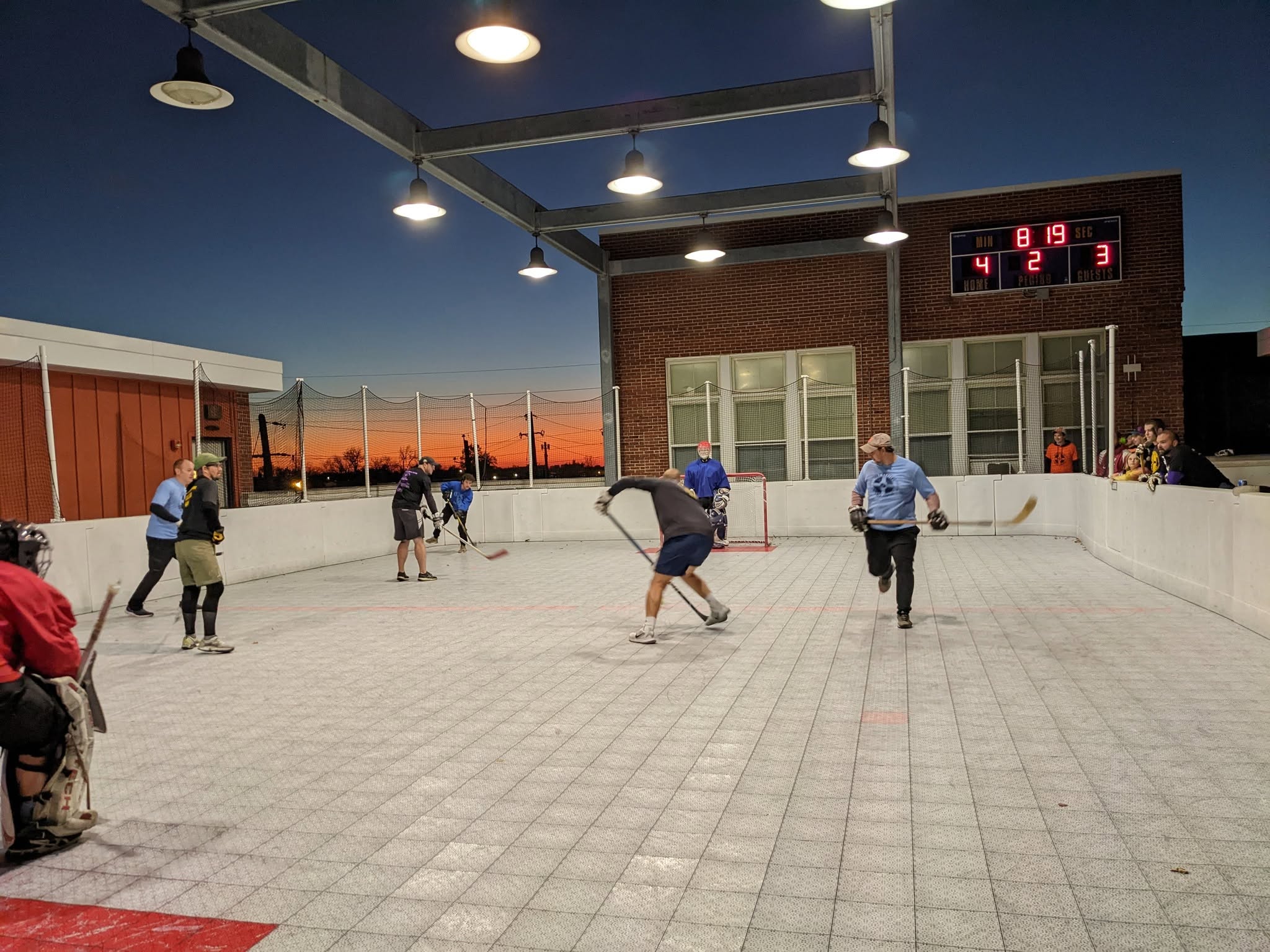 Rooftop ball hockey game action
